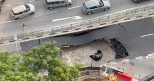 Sinkhole swallows car in Singapore, driver rescued