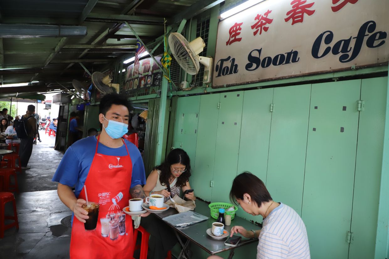 75-year-old Penang kopitiam draws tourist queues