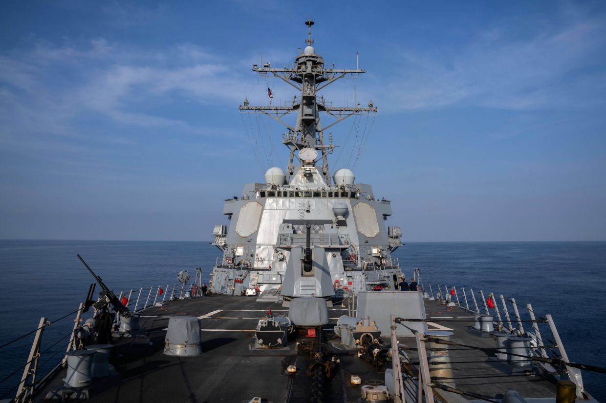 China warns US over military build-up as warships head towards Venezuela