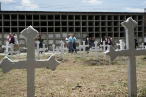 Former Colombian rebels and soldiers work together to exhume remains, give families closure