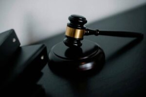 Government director pleads not guilty to abusing position for husband