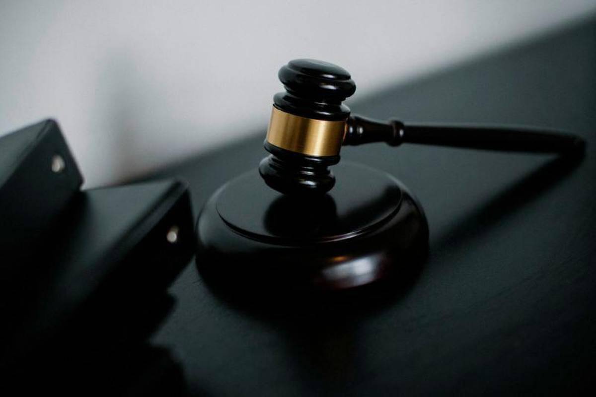 Government director pleads not guilty to abusing position for husband