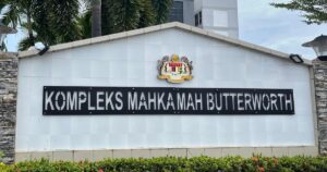 Govt director charged with abusing position to benefit husband’s company