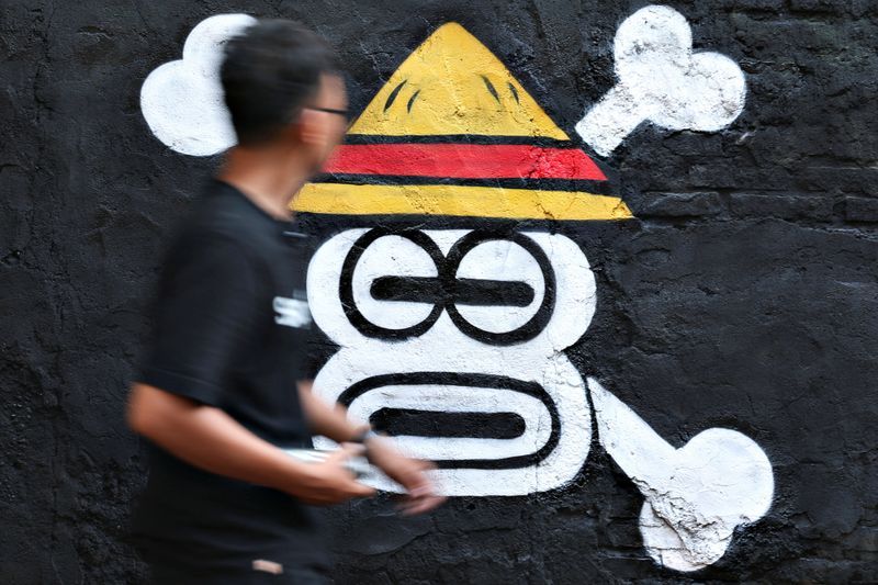 Indonesian artists, students unfurl manga pirate sign as protest symbol
