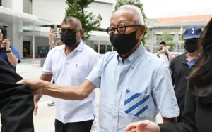 Cover Image for Singapore property tycoon linked to jailed minister pleads guilty