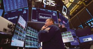 Nasdaq ends at record high, Dow falls as tariff hikes take effect