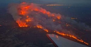 One dead, thousands evacuated as wildfires rage in France and Spain