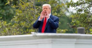 Standing on White House roof, Trump jokes about installing missiles