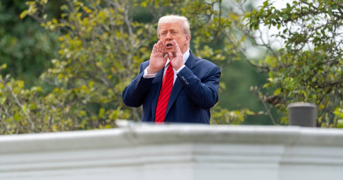 Standing on White House roof, Trump jokes about installing missiles