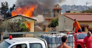 Thousands battle Greece fires as heatwave bakes Europe