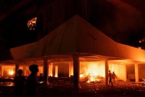 Three dead as Indonesian protesters set fire to regional parliament building