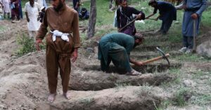 Afghan quake survivors dig graves with pickaxes as entire households wiped out