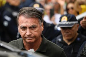Brazil's Bolsonaro taken to hospital after feeling sick, son says