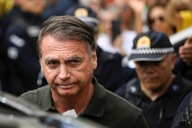 Brazil's Bolsonaro taken to hospital after feeling sick, son says