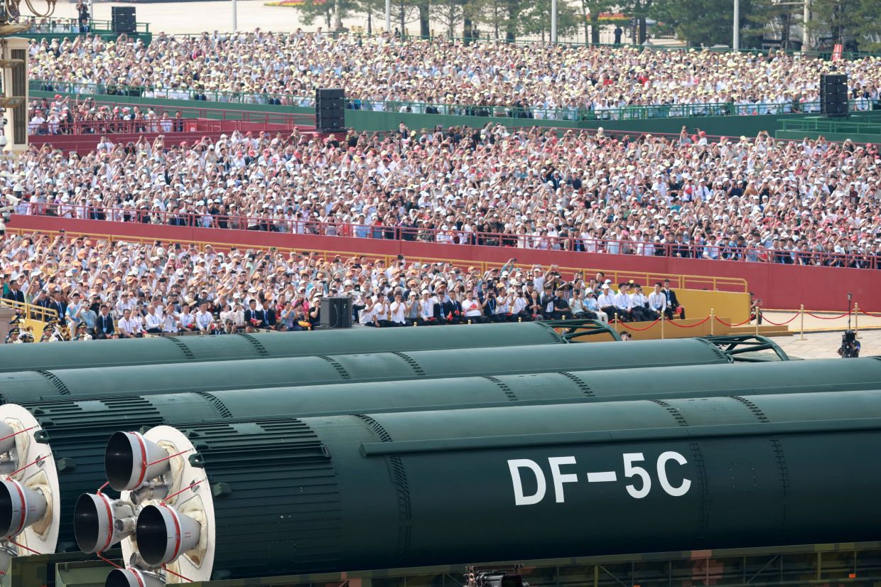 China flexes deterrence muscle with new missile line-up in military parade