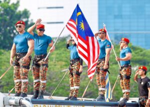 Crowds swoon as uniformed hunks flex their muscles