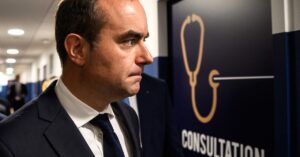 France's new PM courts the left a day after ratings downgrade