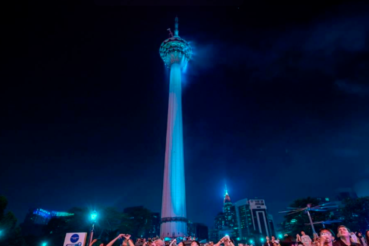 KL Tower lit blue and gold for 50 years of Rukun Tetangga