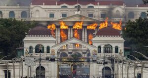 Nepal protesters set parliament ablaze as PM quits