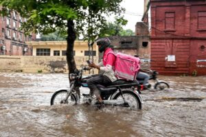 No pause for food delivery riders during Pakistan's monsoon