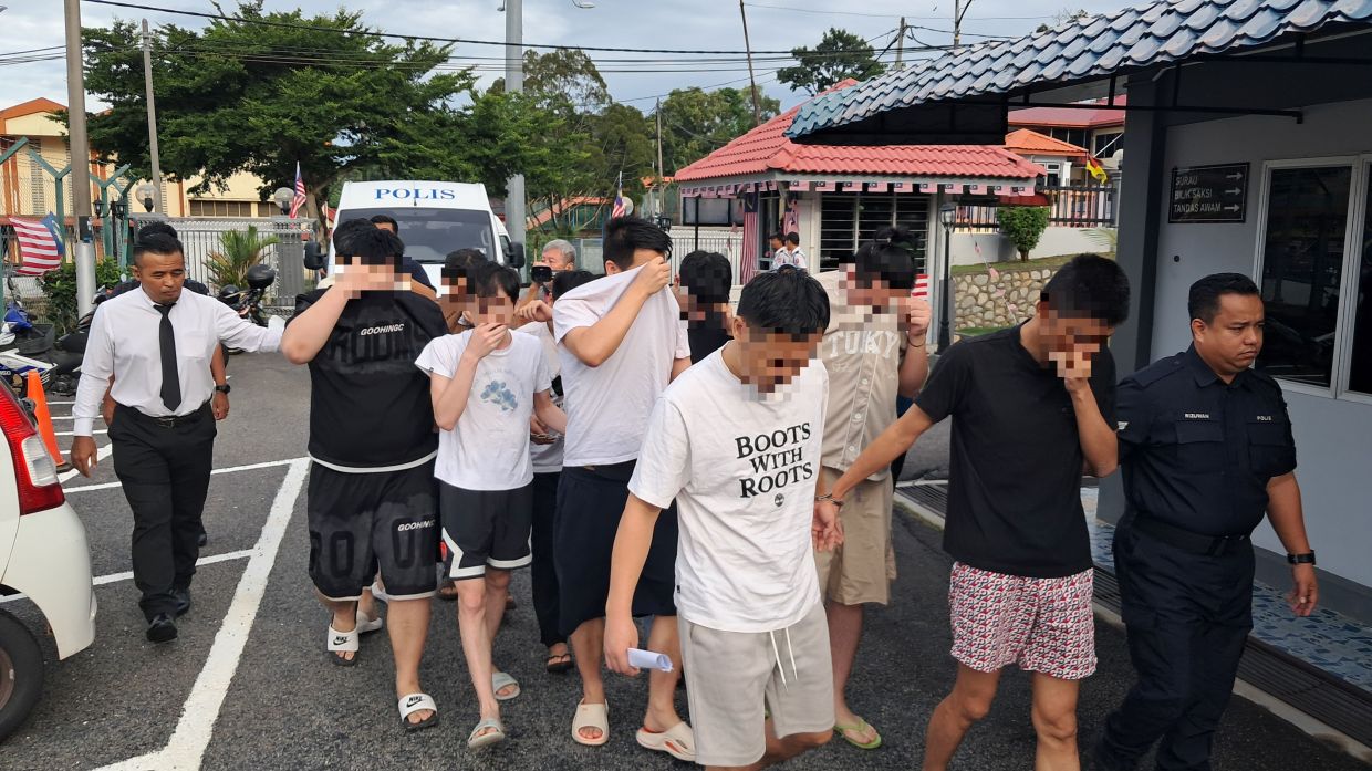 Some of the accused being taken to court to be charged for the offence.