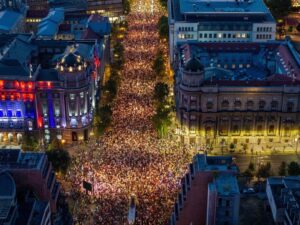 Tens of thousands march in Serbia's capital, demand snap vote