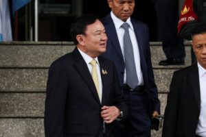 Thailand's influential ex-premier Thaksin Shinawatra leaves country amid turmoil