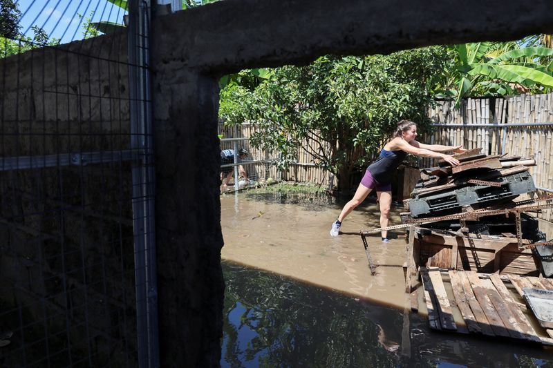Waters recede in Bali after floods kill 16 people, with two still missing