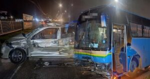 Woman, 69, killed after car collides with workers' bus