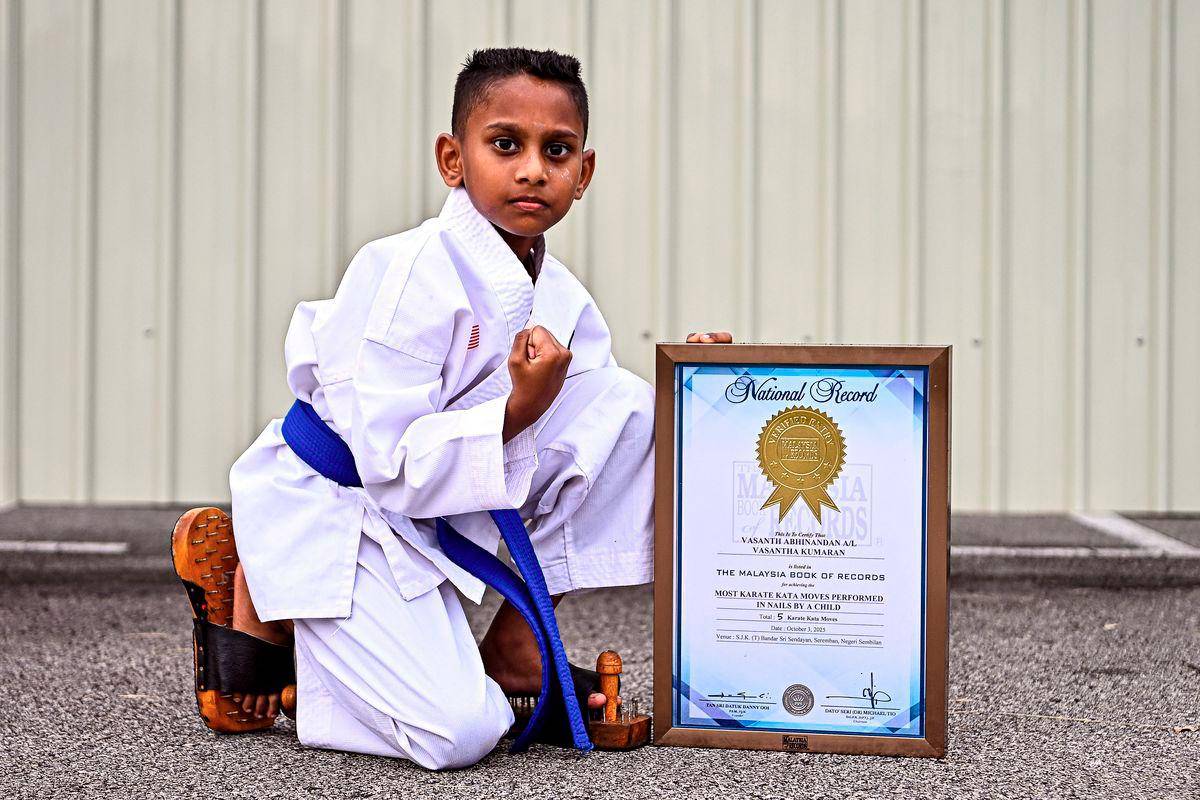 Eight-year-old boy sets MBR record with karate kata on nails