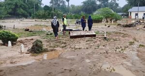 Flood waters dislodge bodies, coffins, tombstones at cemetery