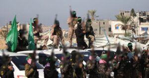 Hamas says postponing hostage body handover due to Israeli truce 'violations'