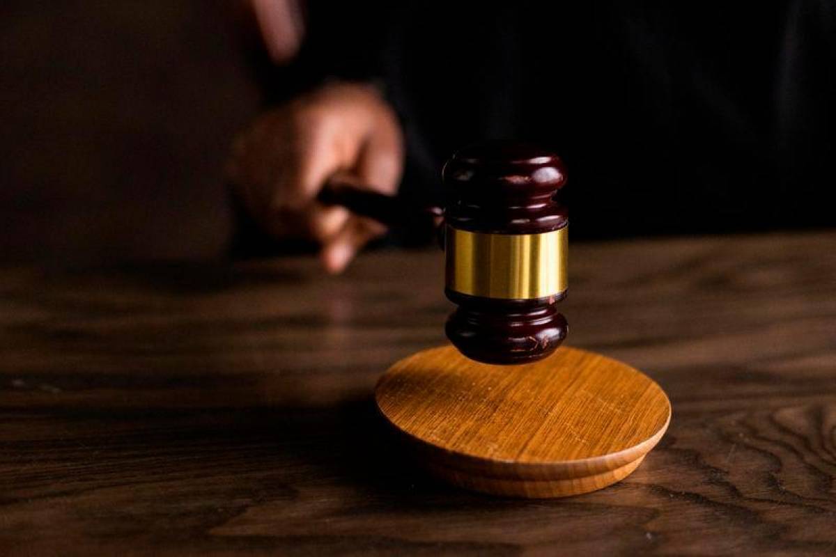 Police witness details pistol discovery in black backpack during raid