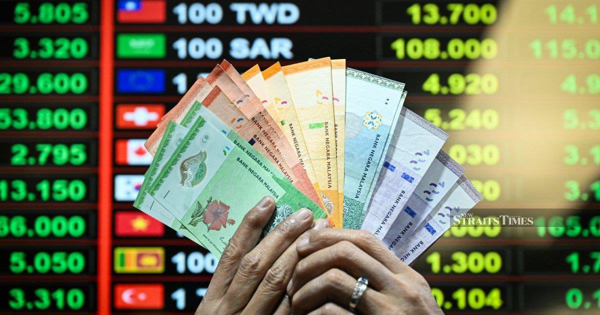 Ringgit opens higher against greenback ahead of US inflation data