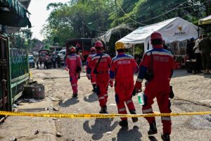 Survivor rescued from collapsed Indonesia school as parents demand faster search