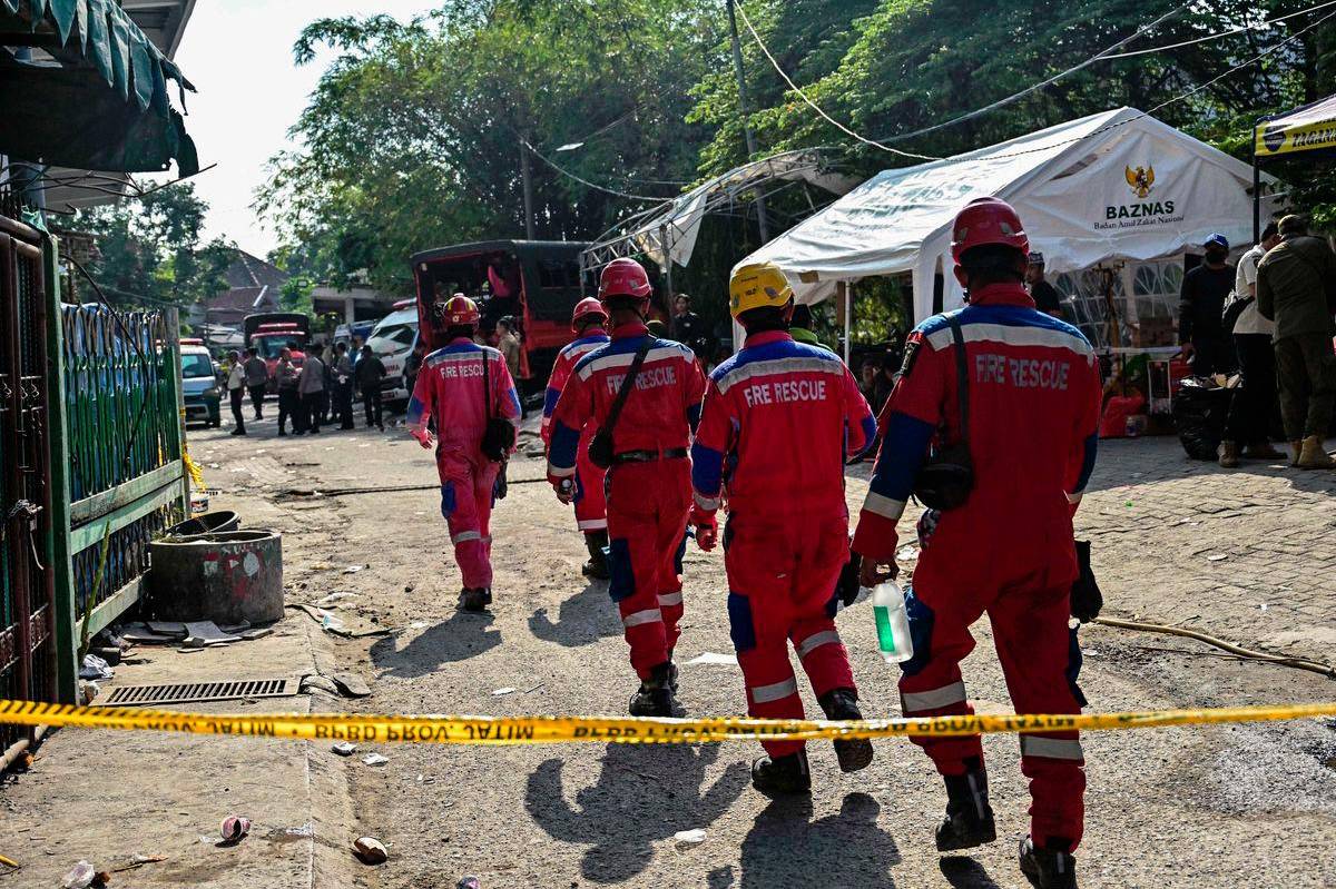 Survivor rescued from collapsed Indonesia school as parents demand faster search