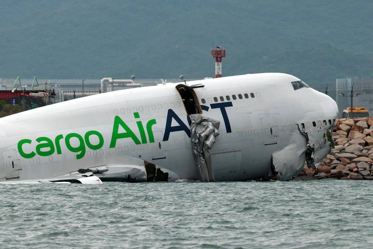 Two Hong Kong airport staff killed after cargo plane runway crash