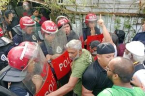 10 people held after tense standoff between residents, police at Kampung Jalan Papan