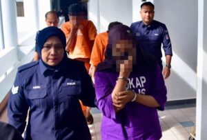 Couple remanded in probe into abuse of adopted son