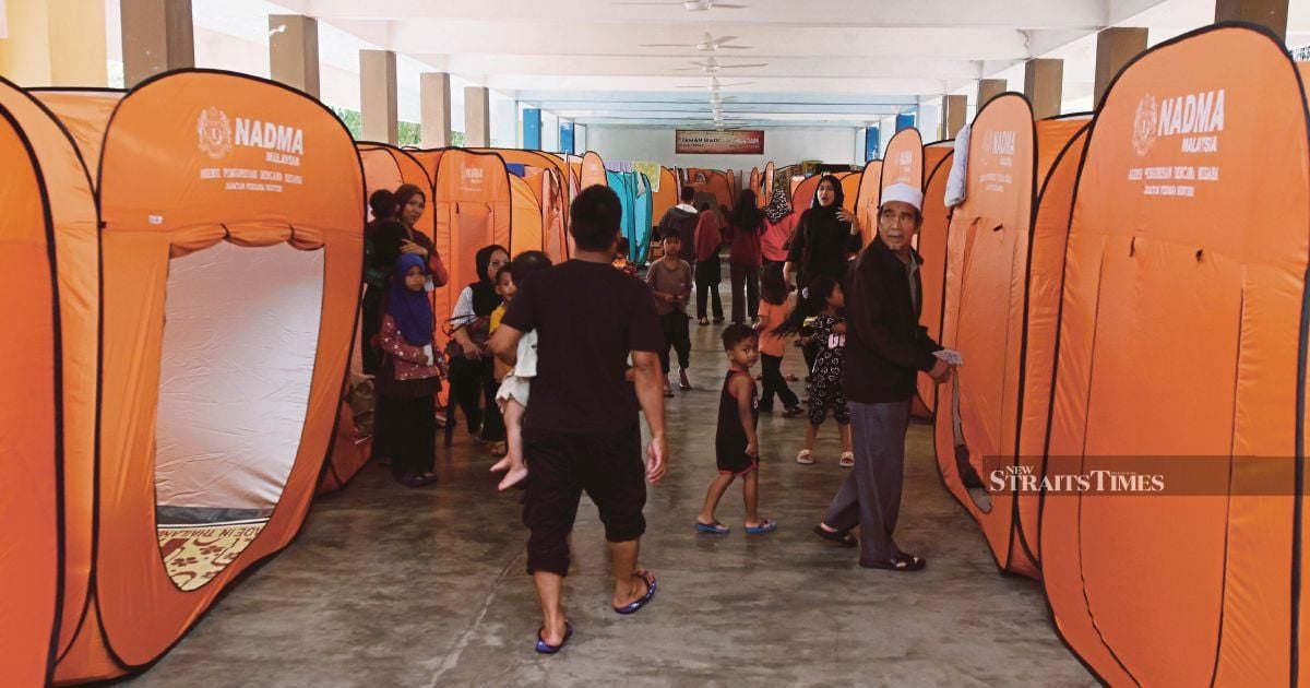 Families forced back to evacuation centre as floodwaters rise in Kelantan