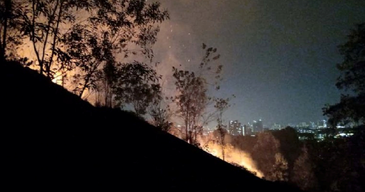 Firefighters battle hillside forest fire in Balakong
