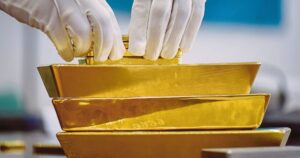 Gold rises more than 1pct on risk-off mood, dollar pause