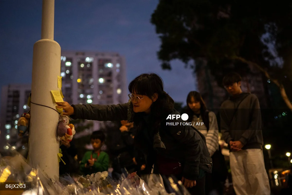 Hong Kong mourns 128 killed in deadly residential tower fire