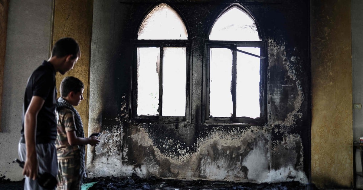 Israeli troops kill two West Bank Palestinians, settlers set mosque ablaze