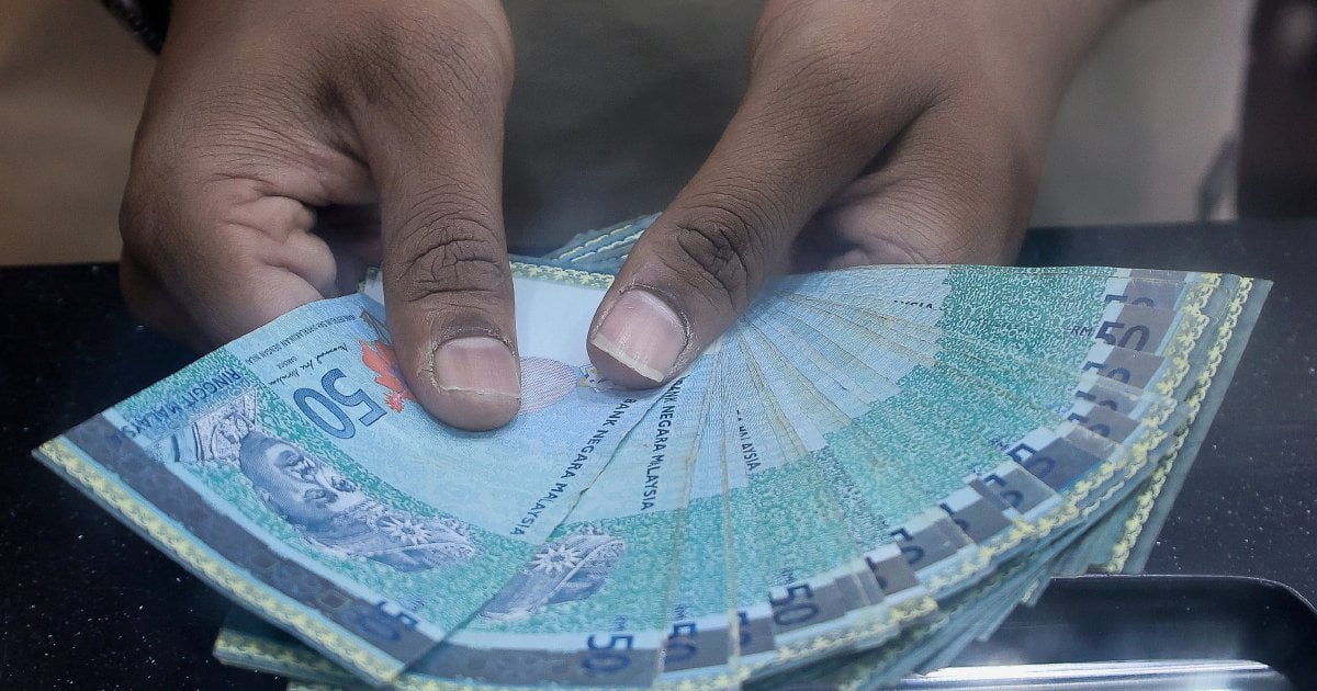 Ringgit opens stronger versus US dollar, market awaits OPR decision