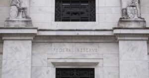 Divided US Fed makes third straight rate cut, signals higher bar ahead