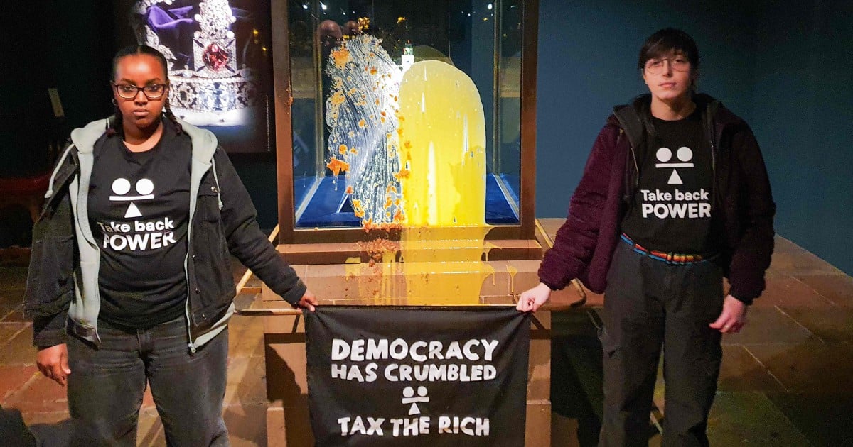 Four arrested at Tower of London after apple crumble and custard thrown at State Crown display