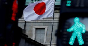 Japan govt approves record budget, including for defence