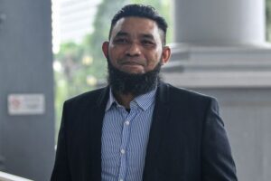 Papagomo charged with failure to notify business changes concerning public donations