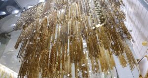 Gold nears US$5,000, silver shines as stocks churn to end turbulent week